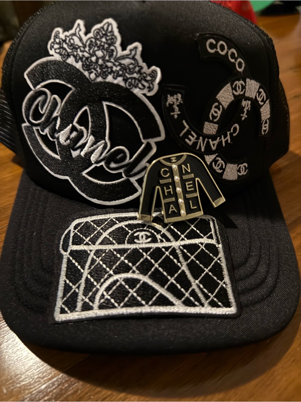 New Fashion Inspired Black Embroidered Patch Trucker Cap with Quilted Bag Motif